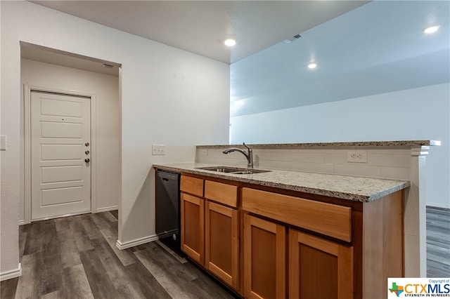 kitchen featuring black dishwasher, decorative backsplash, dark wood-type flooring, and sink