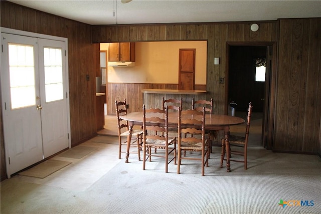 1610 Bexar Ave, Victoria, TX 77901 - dining area featuring wooden walls and light carpet