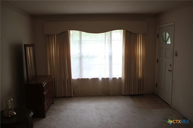 1610 Bexar Ave, Victoria, TX 77901 - foyer featuring crown molding and light colored carpet