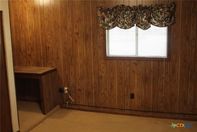 1610 Bexar Ave, Victoria, TX 77901 - unfurnished dining area with wooden walls and light carpet