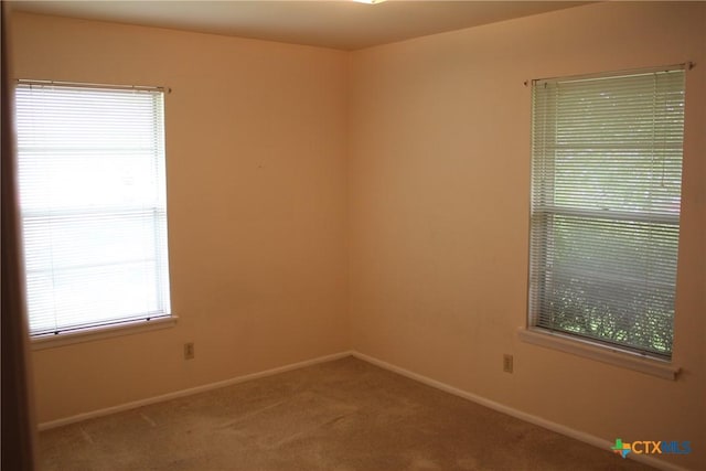 1610 Bexar Ave, Victoria, TX 77901 - carpeted empty room with baseboards