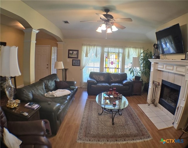 114 Quapaw Dr, Harker Heights, TX 76548 - living area with arched walkways, decorative columns, ceiling fan, and wood finished floors