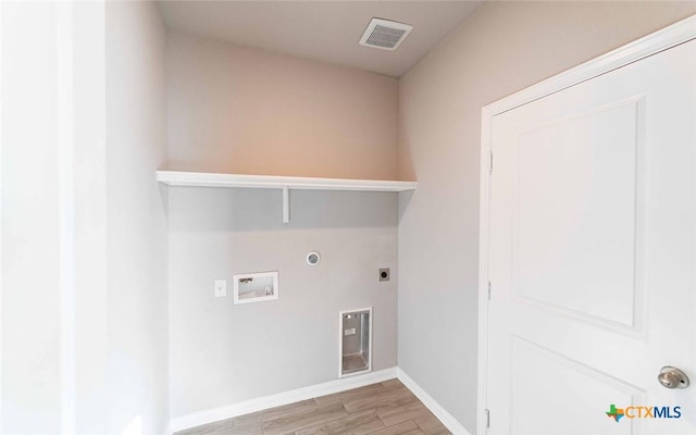 clothes washing area with hookup for a washing machine and hookup for an electric dryer