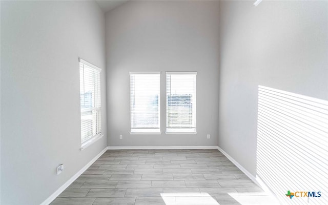 spare room featuring a wealth of natural light