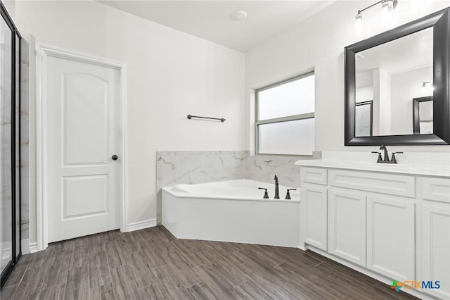 bathroom featuring vanity and a bathtub