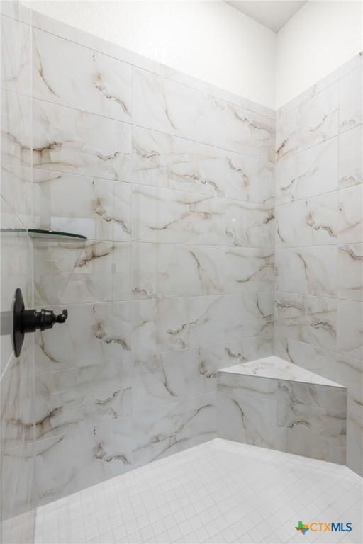 bathroom featuring tiled shower