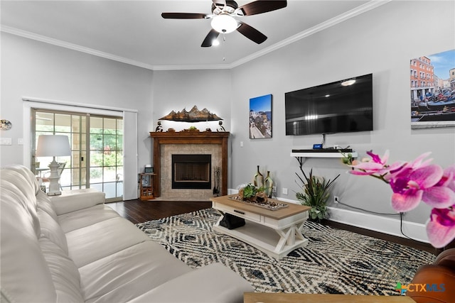 living room featuring ceiling fan, dark hardwood / wood-style floors, and crown molding