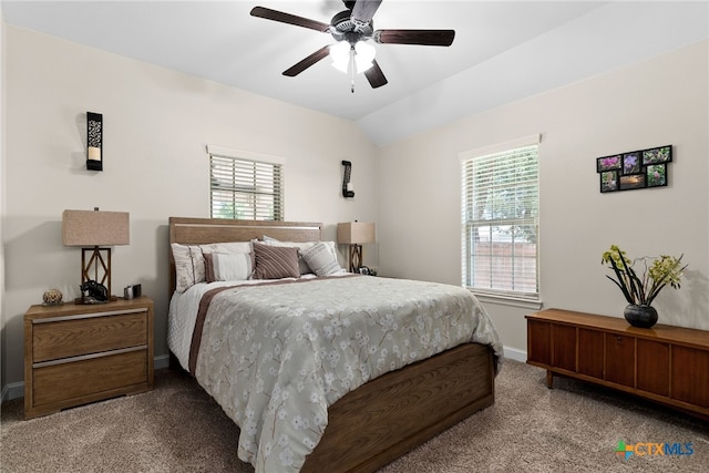 bedroom featuring ceiling fan, lofted ceiling, and light colored carpet