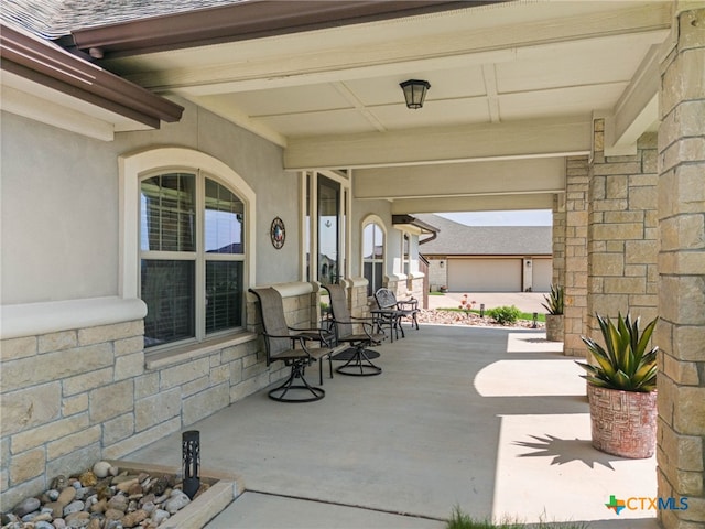 view of patio with a garage