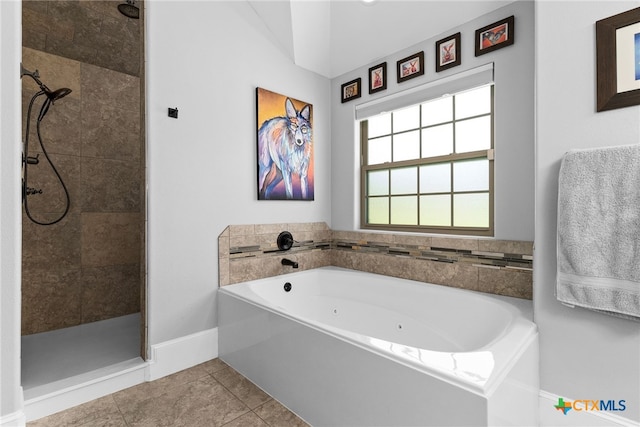 bathroom with tile patterned flooring and separate shower and tub