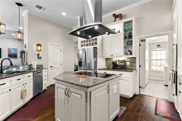 kitchen with island range hood, appliances with stainless steel finishes, sink, dark wood-type flooring, and a center island