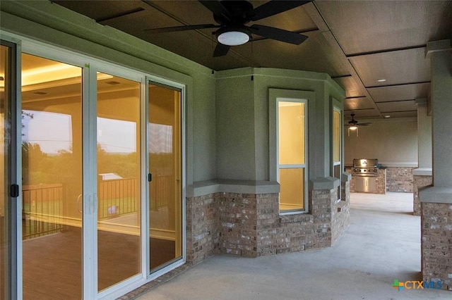 view of patio with grilling area, an outdoor kitchen, and ceiling fan