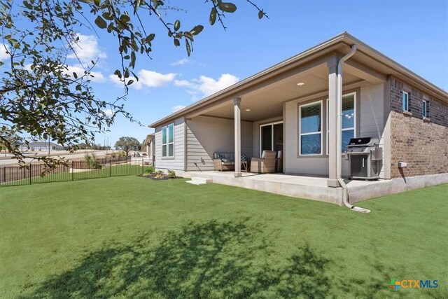 213 Bellows St, Georgetown, TX 78633 - rear view of house with a patio area