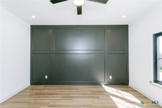 unfurnished bedroom featuring ceiling fan and light wood-type flooring