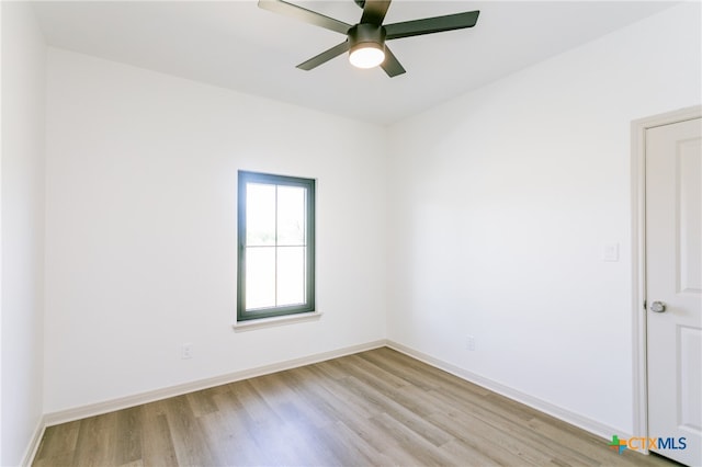 empty room with ceiling fan and light wood-type flooring