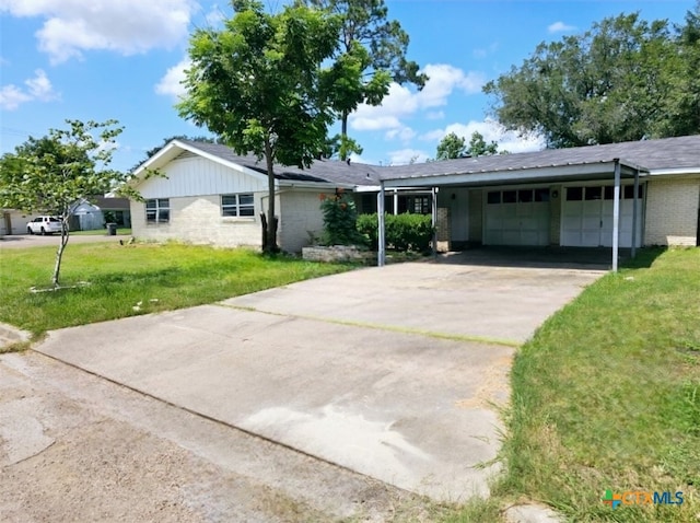 single story home featuring a garage, a carport, and a front lawn