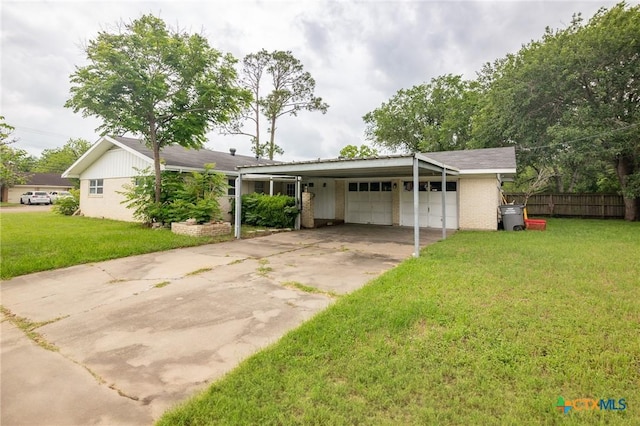 ranch-style home featuring a front lawn, a garage, brick siding, concrete driveway, and fence