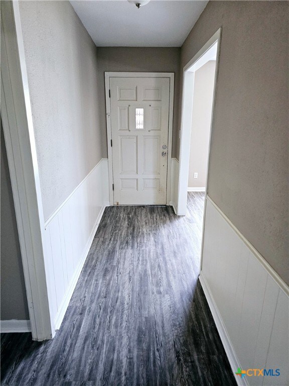 entryway featuring dark wood-type flooring