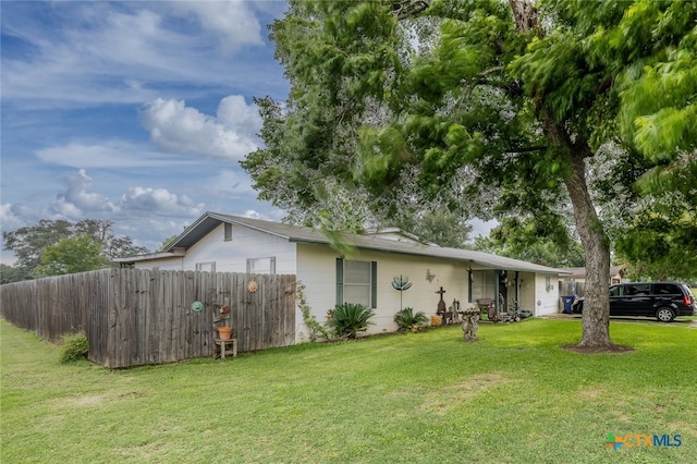 view of property exterior featuring a yard