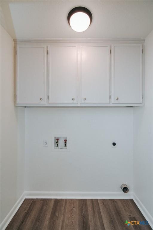 505 Bramble Bush Ln, Victoria, TX 77904 - laundry area featuring dark wood finished floors, electric dryer hookup, washer hookup, and cabinet space