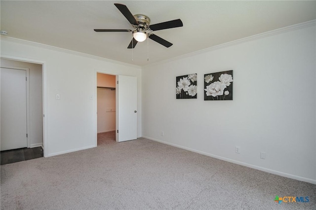 505 Bramble Bush Ln, Victoria, TX 77904 - unfurnished bedroom featuring crown molding, carpet, a walk in closet, and a ceiling fan
