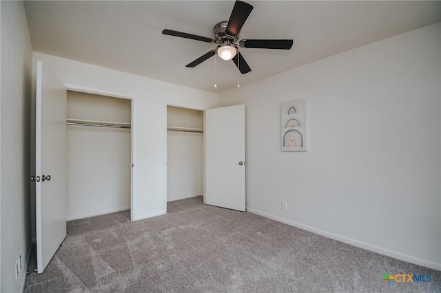 505 Bramble Bush Ln, Victoria, TX 77904 - unfurnished bedroom featuring two closets, carpet, and a ceiling fan