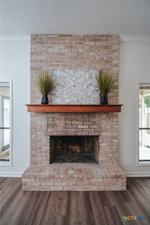 505 Bramble Bush Ln, Victoria, TX 77904 - detailed view of a fireplace, ornamental molding, and wood finished floors