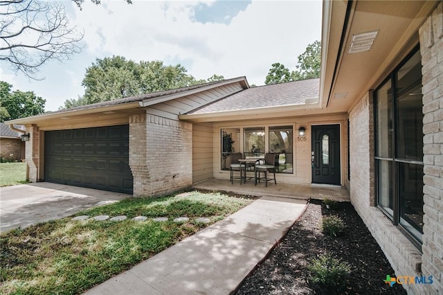 505 Bramble Bush Ln, Victoria, TX 77904 - view of front facade with brick siding, an attached garage, and concrete driveway