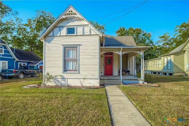 view of front facade with a porch and a front yard