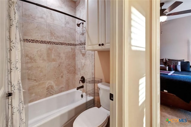 ensuite bathroom featuring toilet, a ceiling fan, shower / tub combo with curtain, and ensuite bathroom