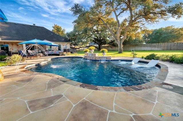 view of pool featuring a fenced in pool, a yard, fence, and a patio