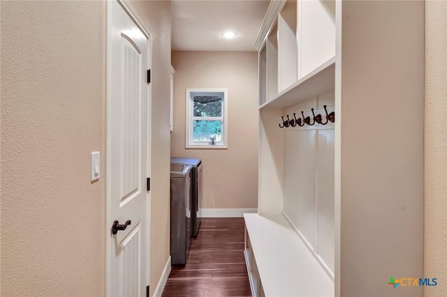 mudroom featuring baseboards, dark wood-style flooring, and independent washer and dryer