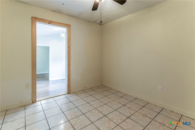 tiled spare room with ceiling fan and lofted ceiling