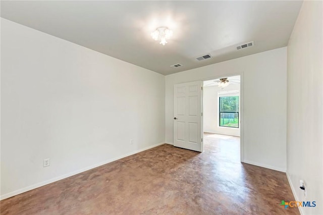 spare room with concrete floors