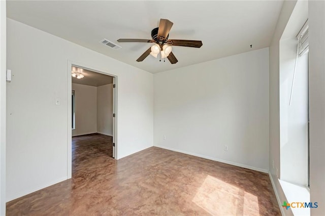 empty room featuring concrete flooring and ceiling fan