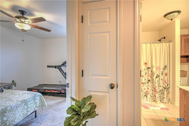 1521 Shadow Canyon Dr, Temple, TX 76502 - bedroom with connected bathroom, light tile patterned floors, and ceiling fan