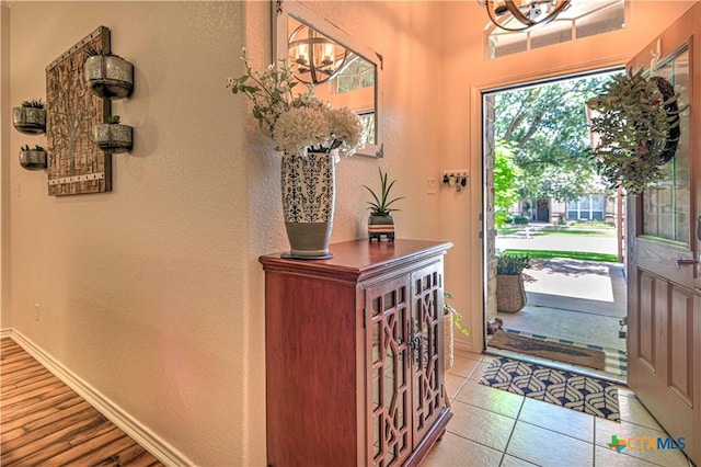 1521 Shadow Canyon Dr, Temple, TX 76502 - entrance foyer featuring a chandelier, a textured wall, and light tile patterned floors