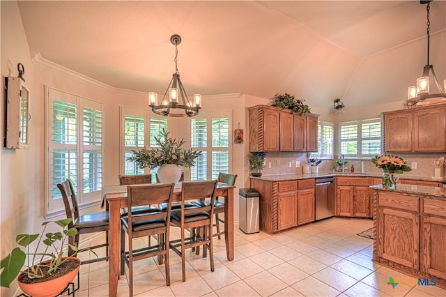 1521 Shadow Canyon Dr, Temple, TX 76502 - kitchen featuring stainless steel dishwasher, a chandelier, brown cabinets, and light tile patterned floors