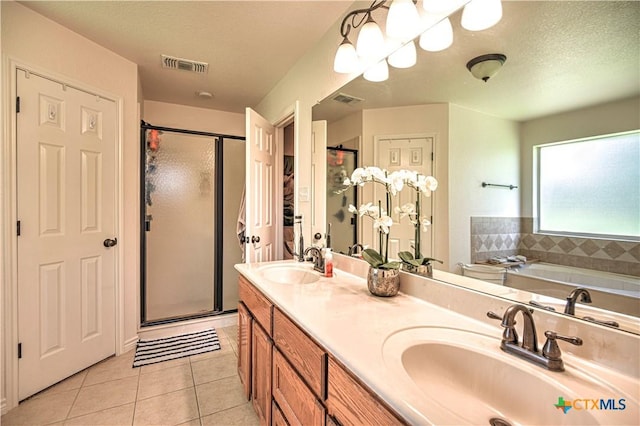 1521 Shadow Canyon Dr, Temple, TX 76502 - bathroom featuring tile patterned flooring, a shower stall, double vanity, and a garden tub