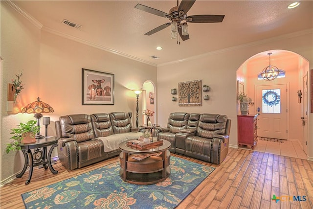 1521 Shadow Canyon Dr, Temple, TX 76502 - living room with arched walkways, wood finished floors, a ceiling fan, recessed lighting, and ornamental molding
