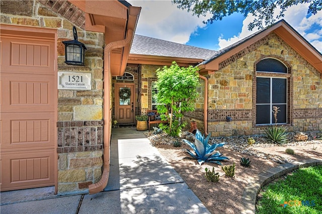 1521 Shadow Canyon Dr, Temple, TX 76502 - view of exterior entry with stone siding and roof with shingles