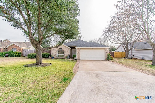 ranch-style house with a garage and a front yard