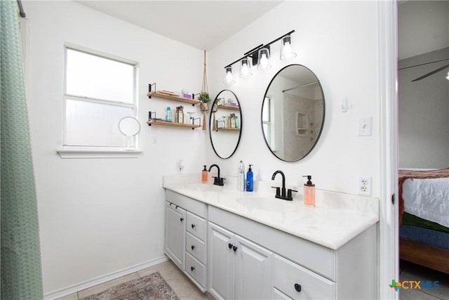 bathroom with ceiling fan, tile patterned flooring, and vanity