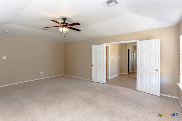 unfurnished room featuring ceiling fan, light carpet, and lofted ceiling