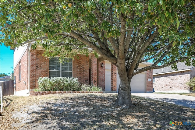 obstructed view of property featuring a garage