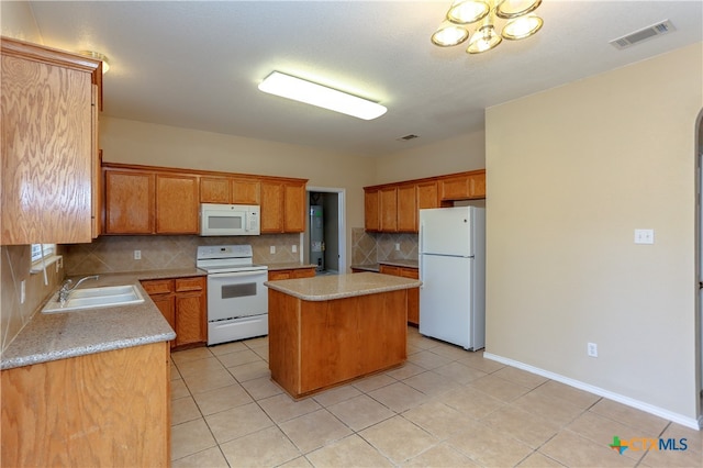 kitchen featuring a center island, decorative backsplash, sink, light tile patterned flooring, and white appliances