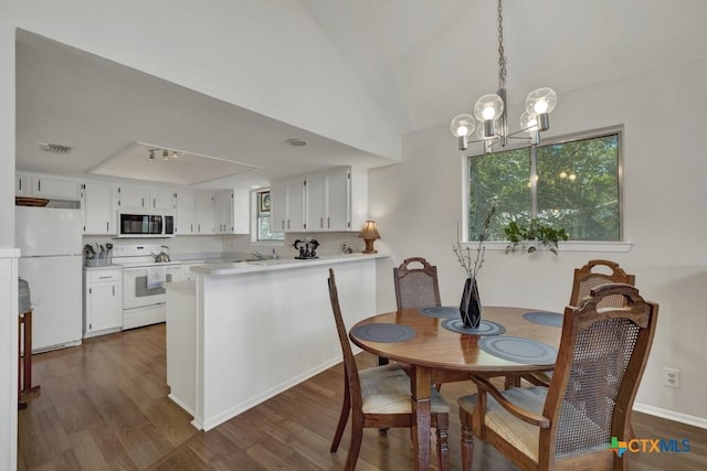 1871 Patty Dr, Canyon Lake, TX 78133 - dining space featuring dark wood-type flooring and a chandelier