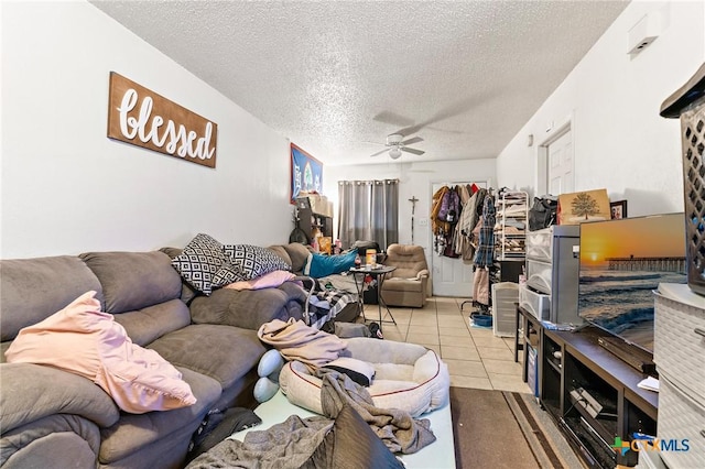 1203 Urbantke Ct Unit A-H, Copperas Cove, TX 76522 - living area featuring a ceiling fan, a textured ceiling, and tile patterned floors