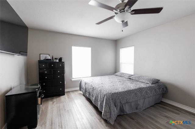 bedroom featuring ceiling fan and hardwood / wood-style flooring