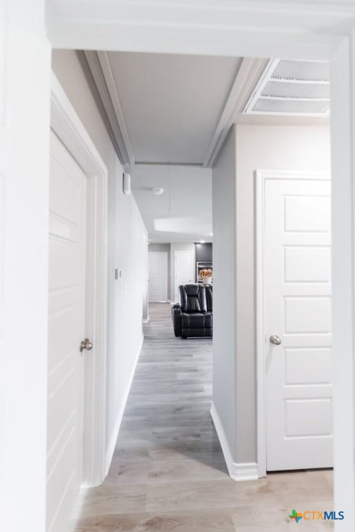 hallway with light wood-type flooring